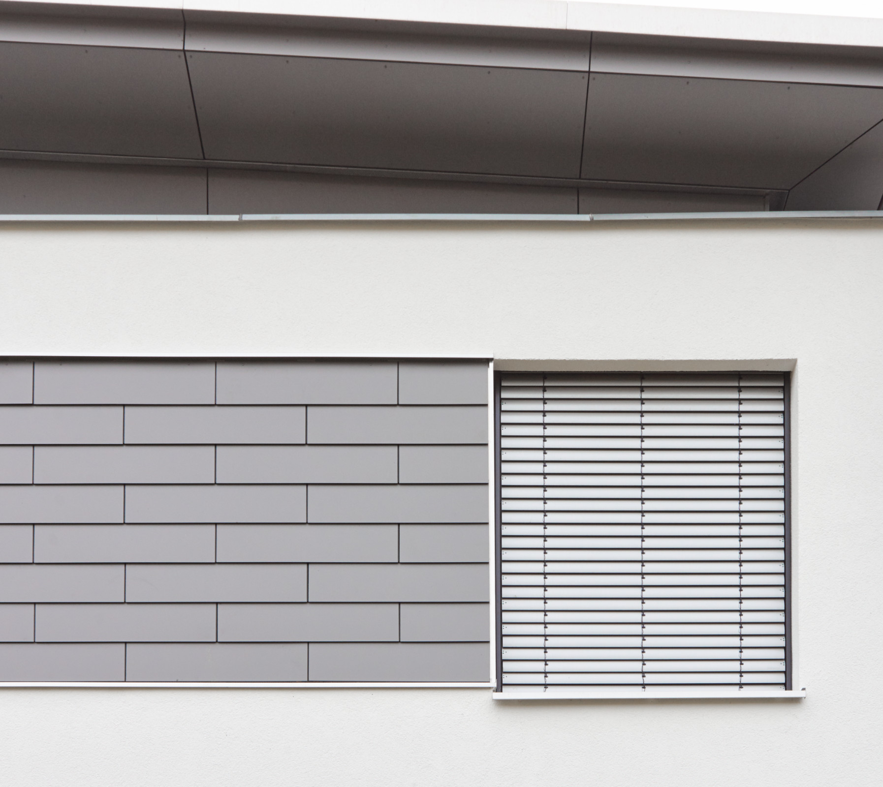 Pultdachverkleidung mit Fundermax Exterior 0075 grau