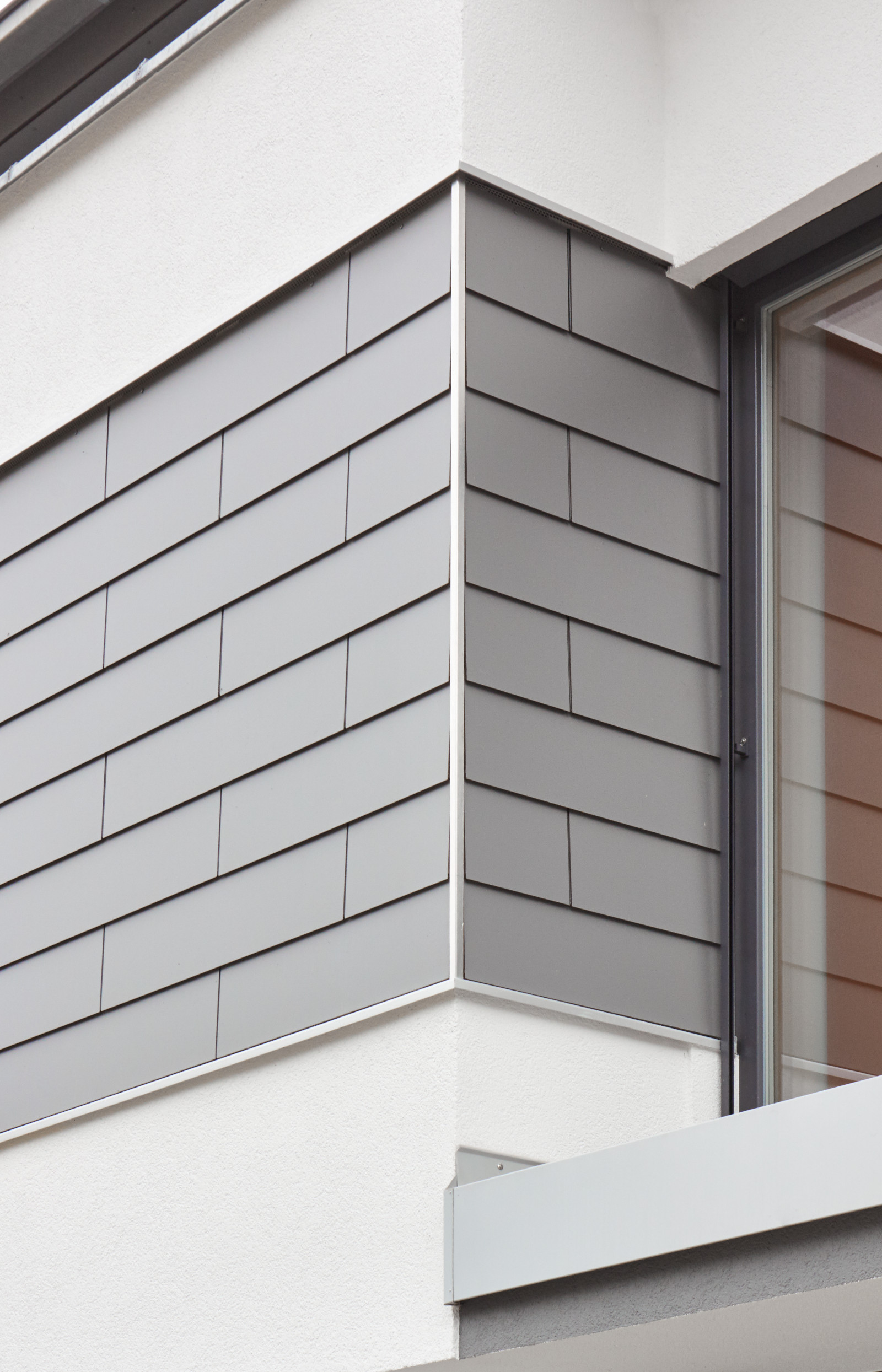 Wandverkleidung mit Pultdachverkleidung mit Fundermax Exterior 0075 grau Stulpschalung